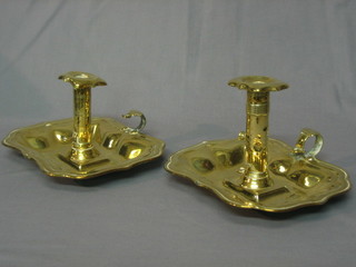 A pair of 18th/19th Century brass chamber sticks with ejectors 8"