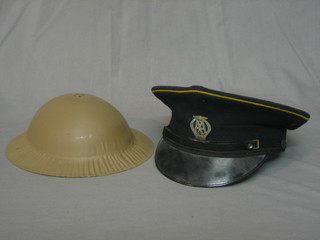 An AA patrolman's peak cap and a childs pressed metal steel helmet