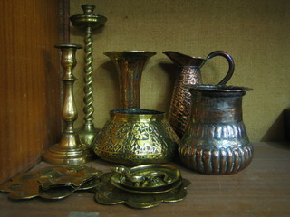 A brass spiral turned candlestick 12", 1 other candlestick 9", a Benares trumpet shaped vase 9", a planished copper jug and a collection of Eastern brassware