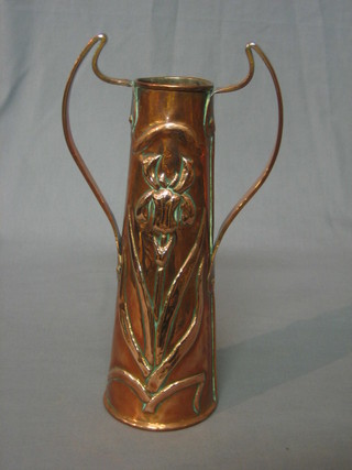 An Art Nouveau embossed copper twin handled vase of cylindrical form 10"