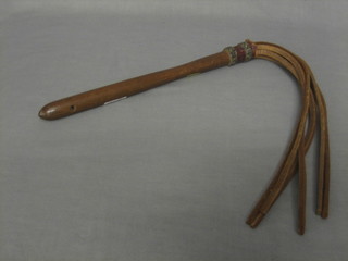 A "German" turned mahogany and leather "fly swish" marked AD GAUXXI