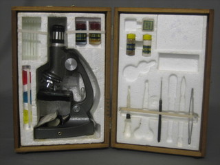 A childs microscope, cased