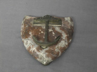 A Victorian polished metal letter clip in the form of a anchor, raised on a marble shield shaped base 5"