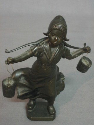 E Sanbriann, a bronze figure of a standing Dutch girl with yoke and pails 6"