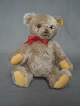 A light brown modern Steiff teddybear with articulated body and growl, the label to the ear marked 011580,  15"