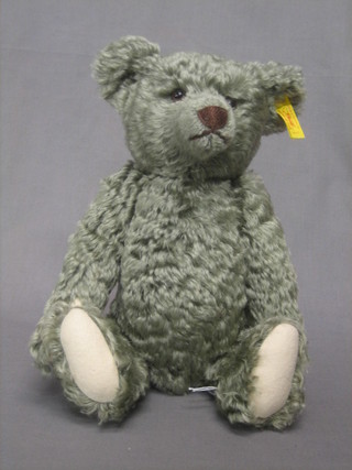 A Steiff green coloured teddybear with articulated body, the label to the ear marked 00317 13"