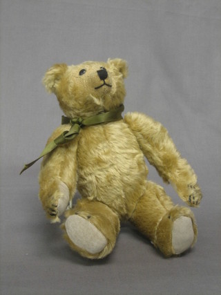 A Harrods yellow teddybear with articulated body 10"