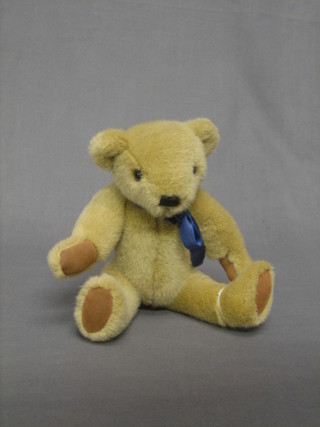 A brown teddybear with articulated limbs, unmarked 9 1/2"