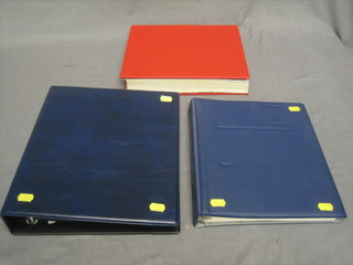 An orange Tower album of World stamps, 2 blue plastic ring binder albums of Colonial and World stamps