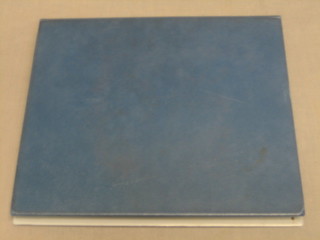 A blue loose leaf album of GB stamps