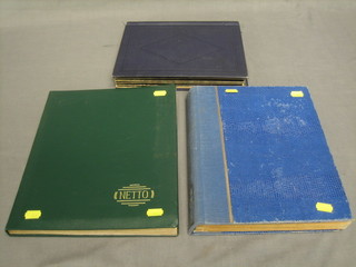 2 blue stock books of World stamps and a green stock book of World stamps
