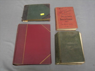 A red Stanley Gibbons album of various World stamps, a Stanley Gibbons part two catalogue of World Stamps 1917, a Stanley Gibbons price catalogue of British Empire stamps 1917 and a small stock book of stamps