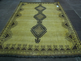 A tan ground Eyadi rug 91" x 67"