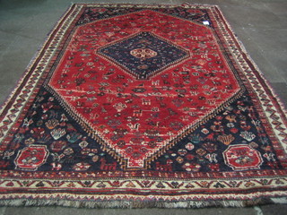 A contemporary Shiraz Kashkari rug with diamond shaped lozenge to the centre 104"x63"