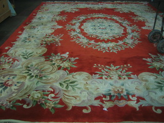 A red ground and floral patterned Chinese carpet (some moth) 147" x 110"