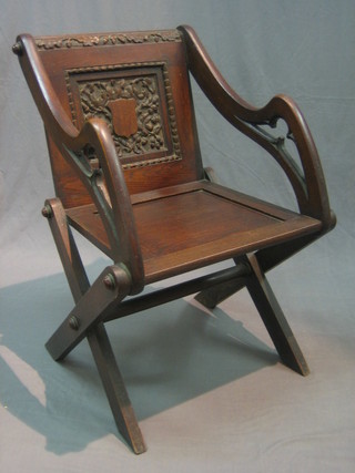 A Victorian carved oak Glastonbury chair