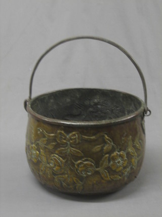 A circular embossed Dutch brass coal bin with iron swing handle 14"