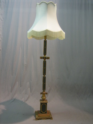 A green and gilt metal standard lamp