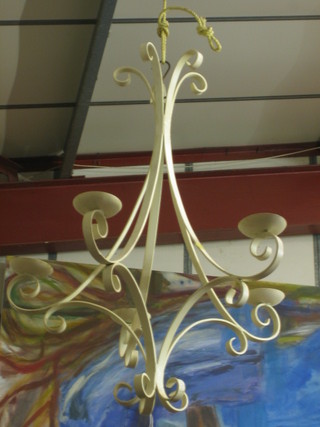 A white wrought iron hanging 5 light candle holder 