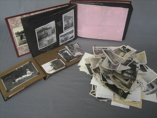 2 albums of black and white photographs together with a small collection of loose black and white photographs