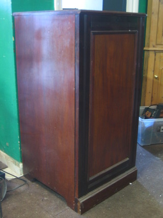 A Victorian mahogany pedestal collectors cabinet fitted 17 drawers enclosed by a panelled door and raised on a platform base 21"