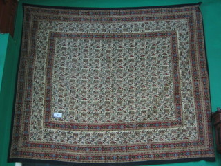 A large beige ground block printed woolwork wall hanging 102" x 86"
