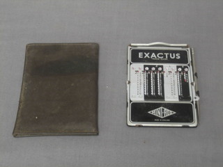An Exactus Mini-add calculator complete with instructions