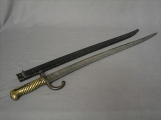 A 19th Century French chassepot bayonet the blade engraved 1874, complete with metal scabbard