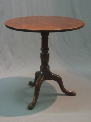 A Victorian circular mahogany snap top tea table, raised on pillar and tripod supports 27"
