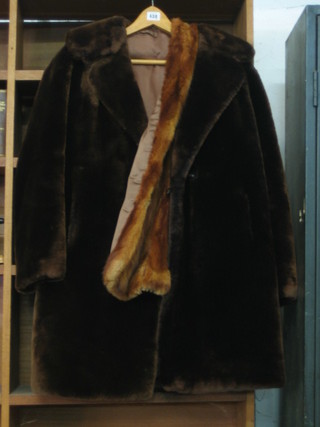 A lady's full length fur coat and 1 other