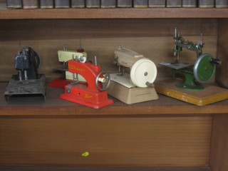 A childs Grain manual sewing machine together with 4 others