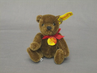 A brown Steiff miniature teddybear with articulated limbs 5"