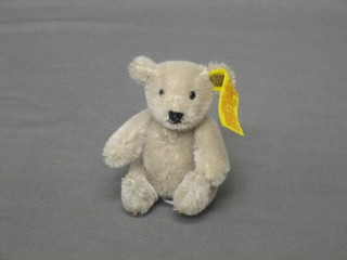 A miniature white Steiff teddybear with articulated limbs 4"