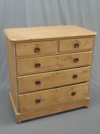 A 19th Century D shaped pine chest of 2 short and 3 long drawers with brass drop handles, raised on bun feet 36"