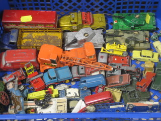 A collection of various toy cars and lead figures