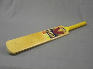 A Slazenger V short handled cricket bat, signed by the England 1997 Sharja Trophy winners including