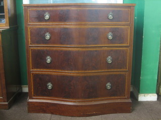 An Edwardian Sheraton style inlaid mahogany chest of serpentine outline, fitted 4 long drawers raised on a platform base 41"