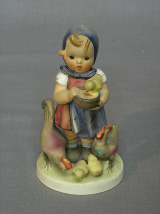 A Goebel figure of a standing girl with chickens 5"