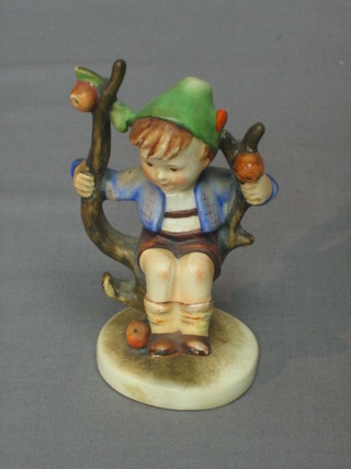 A Goebel figure of a boy in an apple tree, base marked 1955 4 1/2"