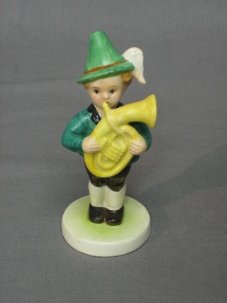 A Goebel figure of a standing boy with French Horn 5"