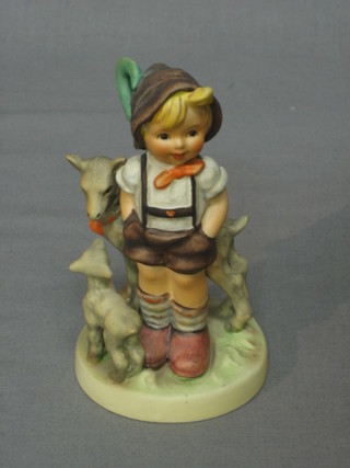 A Goebel figure of a boy standing with 2 goats 4"