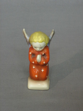 A Goebel figure of a kneeling Angel in prayer 3" (slight chip to right hand wing)