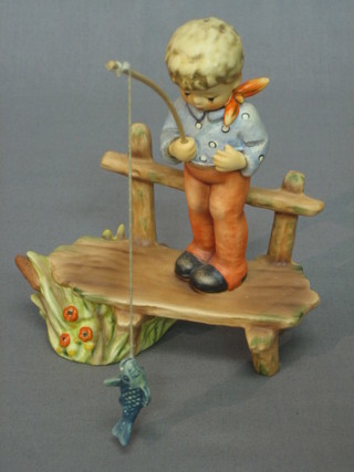 A Goebel figure in the form of a boy fishing, first issue 1995, 7"