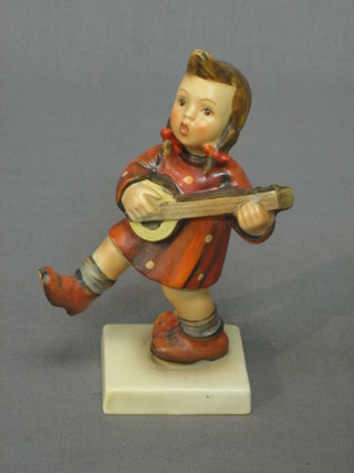 A Goebel figure of a standing girl playing a mandolin 5 1/2"