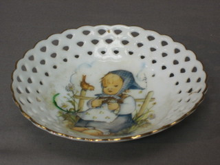 A Goebel circular porcelain ribbonware plate decorated a seated girl 5"