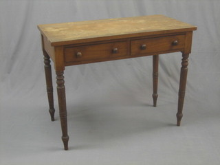 A 19th Century mahogany side table fitted 2 drawers, raised on turned supports 40"