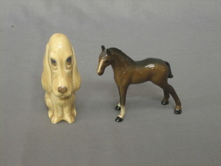 A Doulton figure of a standing bay foal 3 1/2" and a Sylvac style figure of a seated dog 4"