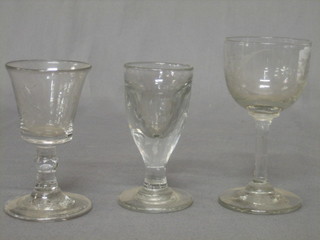 A 19th Century etched wine glass and 2 antique wine glasses