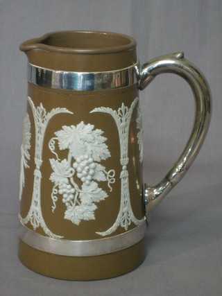 A 19th Century brown glazed Turnerware style jug decorated grapes with silver plated handle 7"