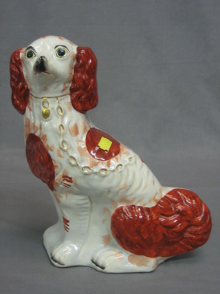 A Staffordshire figure of a brown and white seated Spaniel 11"